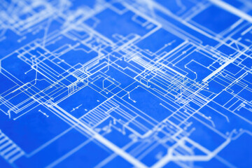 Blueprint of architectural design with complex white lines on blue background