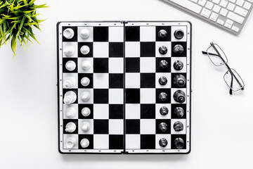 Challenge and leadership concept. Chess board on office table, top view