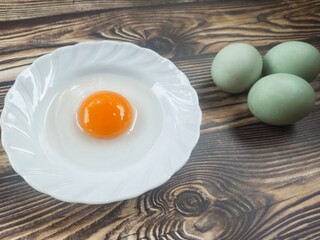 Duck eggs on a wooden table