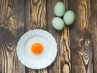 Duck eggs on a wooden table
