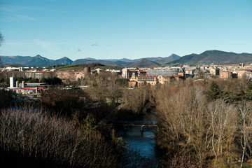 Arga river flowing through pamplona cityscape in navarre, spain