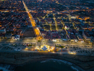 Sakarya High-angle, nighttime shot of a town bordering a beach.Aerial view of a coastal town at night, illuminated by city lights. Karasu Adapazari Turkiye Drone Shot Turkey 