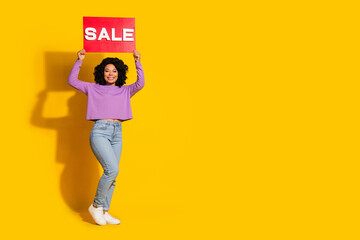 Full size photo of nice young woman sale blank empty space isolated on yellow color background