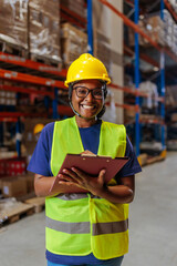 Female African-American warehouse worker smiling