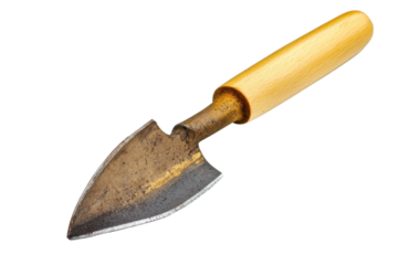 A well-used garden trowel resting on a clean surface after a day of planting spring flowers