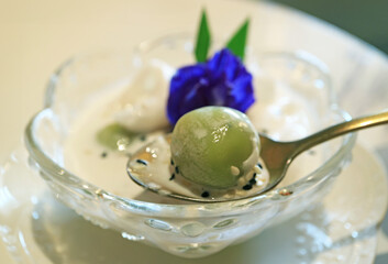 Closeup of Khanom Kho Kati, Delicious Thai Southern Coconut Dumplings in Sweetened Coconut Milk
