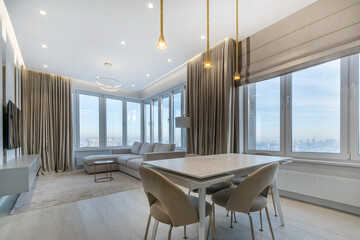 Magnificent panoramic view from the windows of a modern studio apartment. Elegant interior design.