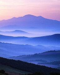 Fototapeta premium Serene landscape with layered mountains at dawn, showcasing soft hues.