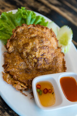Jasmine rice topping with Thai style omelet stuffed minced pork. Thai called Kai jeow moo sab