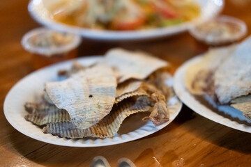 Grilled dried squid on paper dish. Thai street food.