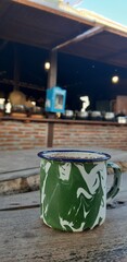 A mug of coffee milk served on wooden table