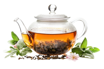 A clear teapot brews fragrant tea surrounded by fresh herbs and delicate flowers