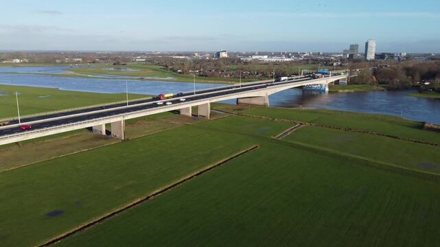 Zwolle, the Netherlands - January 8th 2025: Close-up aerial footage of n the A28 or E232 highway bridge crossing the river IJssel into Overijssels capital Zwolle.