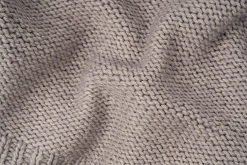 Grey wool sweater texture as a background.