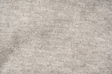 Grey wool sweater texture as a background.