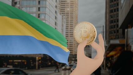 Golden bitcoin held by a hand with a waving Gabon flag in the background against a modern urban cityscape