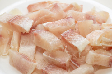 Pangasius fish fillet by pieces. Fresh fish fillet.