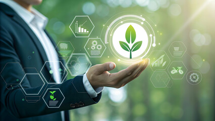 Businessman Holding Digital Plant Icon in Nature Background