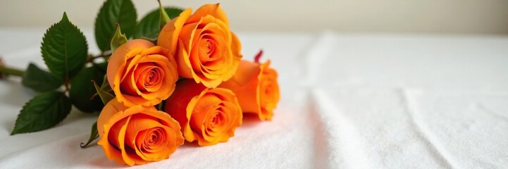 Orange roses stacked high on a simple white tablecloth, fabric, orange