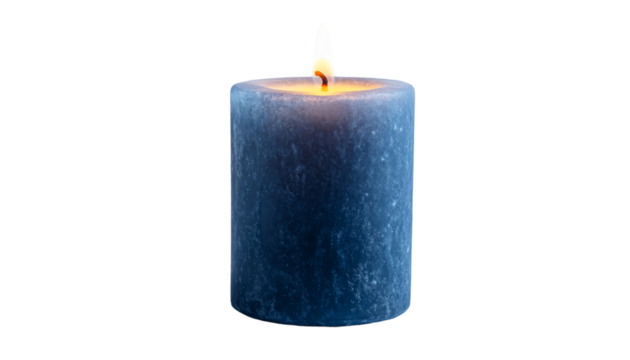 A lit candle with a colored wax exterior and flame, set against