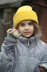 street portrait of a little girl, expressive eyes, natural beauty
