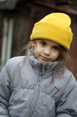 street portrait of a little girl, expressive eyes, natural beauty