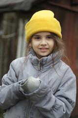 street portrait of a little girl, expressive eyes, natural beauty