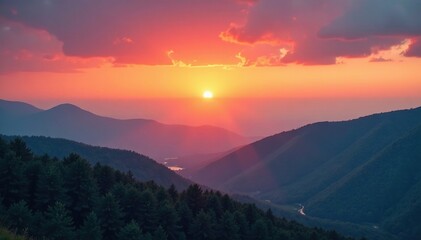 Obraz premium Red and yellow clouds dissolve slowly above the rolling hills at sunset, misty, cloud