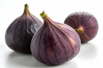 Fresh Ripe Figs with Smooth Purple Skin on White Background