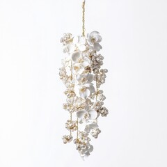 Elegant floral arrangement featuring delicate white orchids and decorative accents, suspended beautifully against a light background.