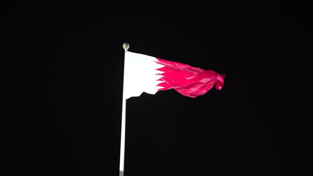 Qatari flag at black background from Qatar national day celebration 