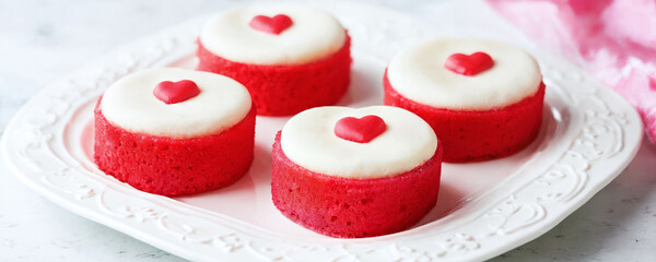 Red heart-shaped desserts on a white plate perfect for celebrations or gatherings. Valentine’s Day idea, date, engagement party, love party, eat, food