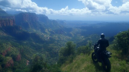 Obraz premium Motorcyclist Views Breathtaking Mountain Valley Panorama