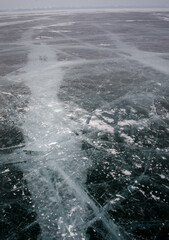 Naklejka premium Frozen lake Baikal, transparent and with cracks