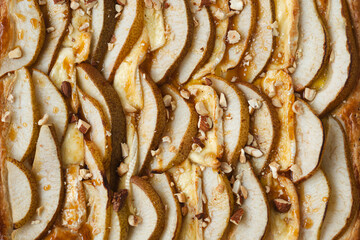 Puff pastry pie with camembert, pear slices, honey and nuts.