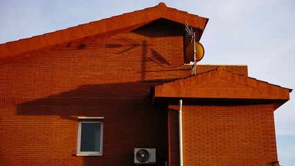home side red brick facade against the sky