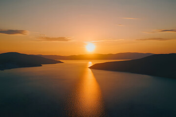 Obraz premium Beautiful sunset over the sea with an orange sky and sun, a summer landscape