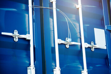 Container door locked with protective lead seal. Security of cargo shipment. shipping truck...