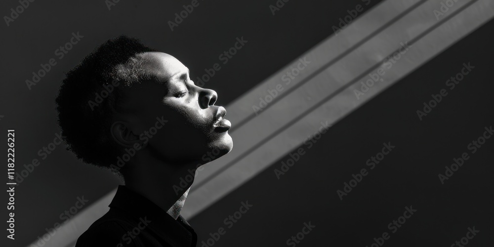 Poster a figure slowly emerges from the void, lit by a single light, creating a serene, mysterious atmosphe