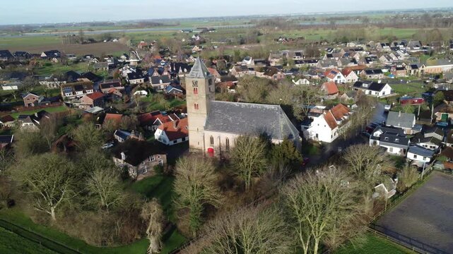 Zalk, the Netherlands - January 8th 2025: Close-up footage of the Sint Nicolaas church and the village near the river IJssel. 