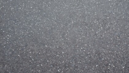 Fototapeta premium high-resolution close-up of asphalt texture with small gravel and fine cracks, ideal for backgrounds, urban design, or road surface studies
