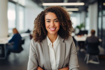 Smiling portrait of a young African American businesswoman in modern office