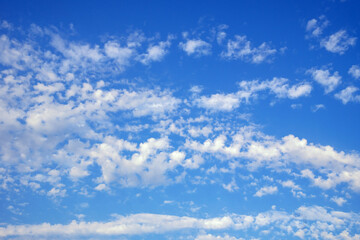 Beautiful fluffy white clouds in blue sky, background