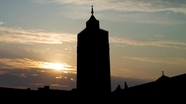 Islamic Mosque Tower and Minaret of Al Zaytuna Mosque in the Medina of Tunis, Time Lapse at Sunrise with Beautiful Sky, Tunisia