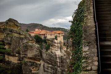 Beautiful monastery sits on cliff viewed from Great Meteoro Monastery. Greece