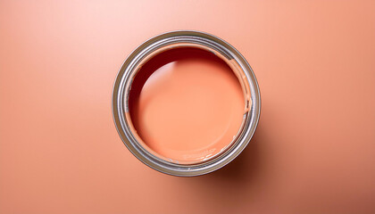 open can of wall paint with color of the year 2024 peach fuzz on a pastel peach background