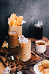  ice coffee in glass with crispy snacks capturing the perfect vertical shot  for coffee lovers.