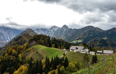 Amazing Aerial view of Logar valley. Slovenia. Cloud, peaks and houses. Autumn