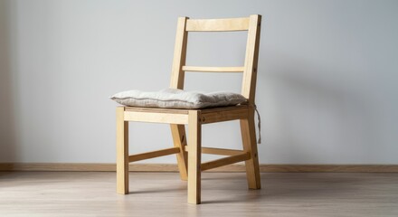 Fototapeta premium Wooden chair with light cushion in minimalist room