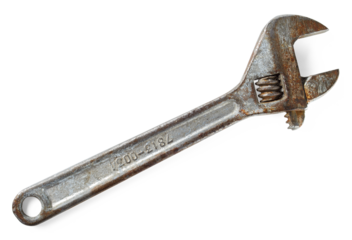 Old rusty adjustable wrench. Variable-size wrench used to rotate nuts, bolts, and other parts,  ideal for plumbing, mechanical repairs.